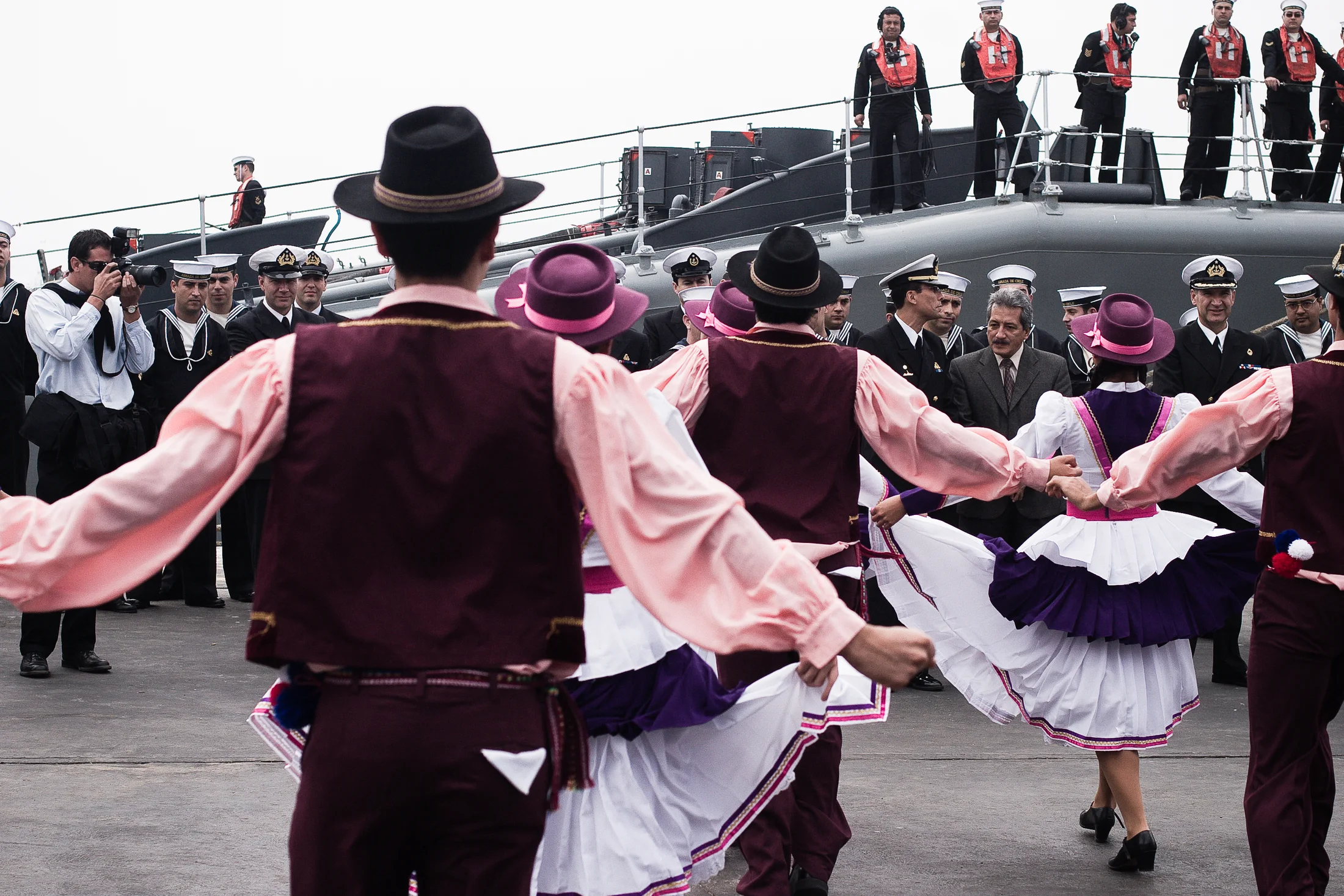 A folkloric dance group performs in front of a crowd in Arica