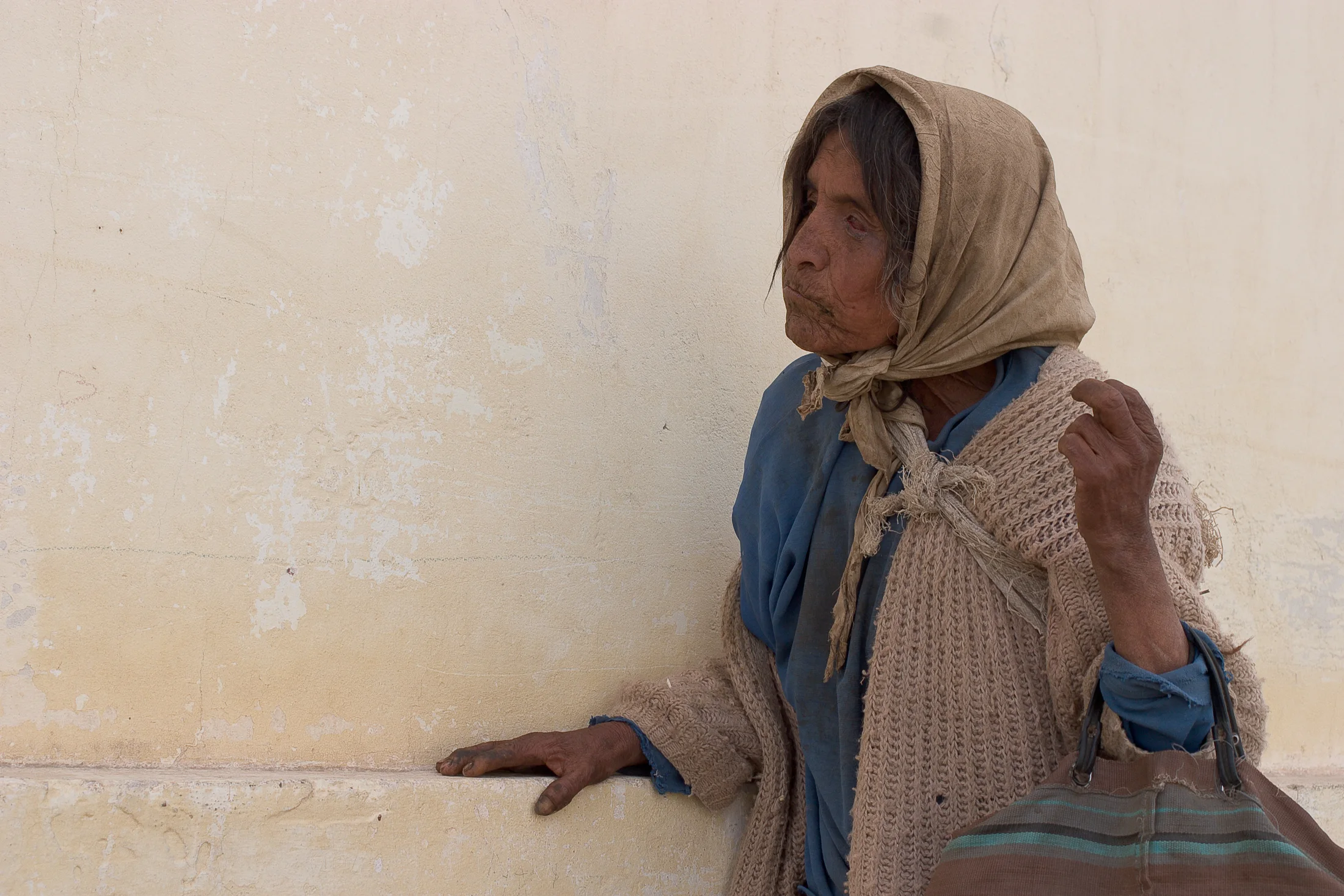 Portrait of an older woman wearing a headscarf in Cachi
