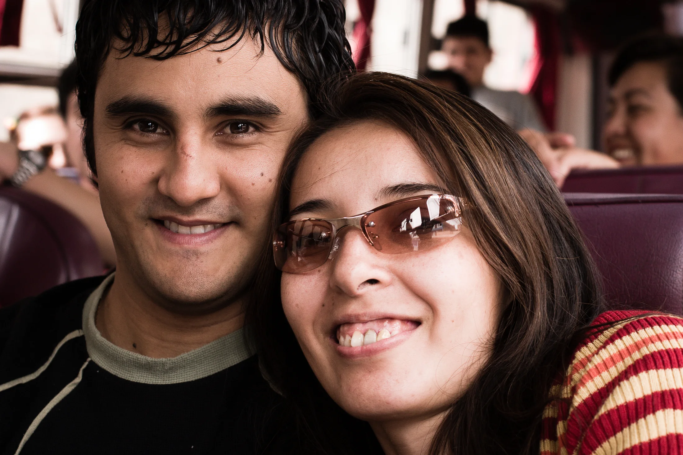 Friends talking together on a bus in Lima