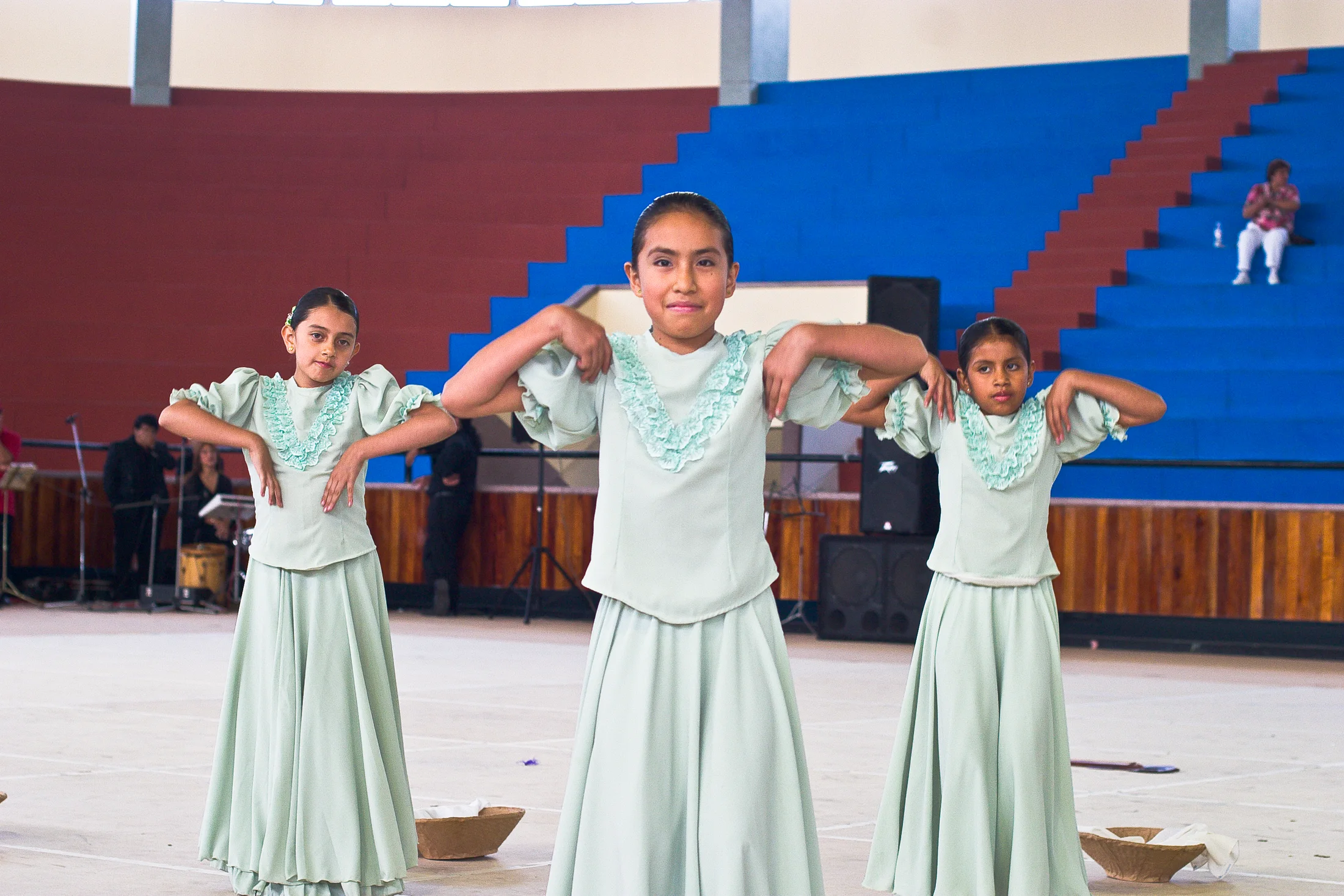 Four young dancers perform in pale blue dresses